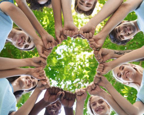 group-of-people-fist-bump-assemble-together-NGRU58U.jpg